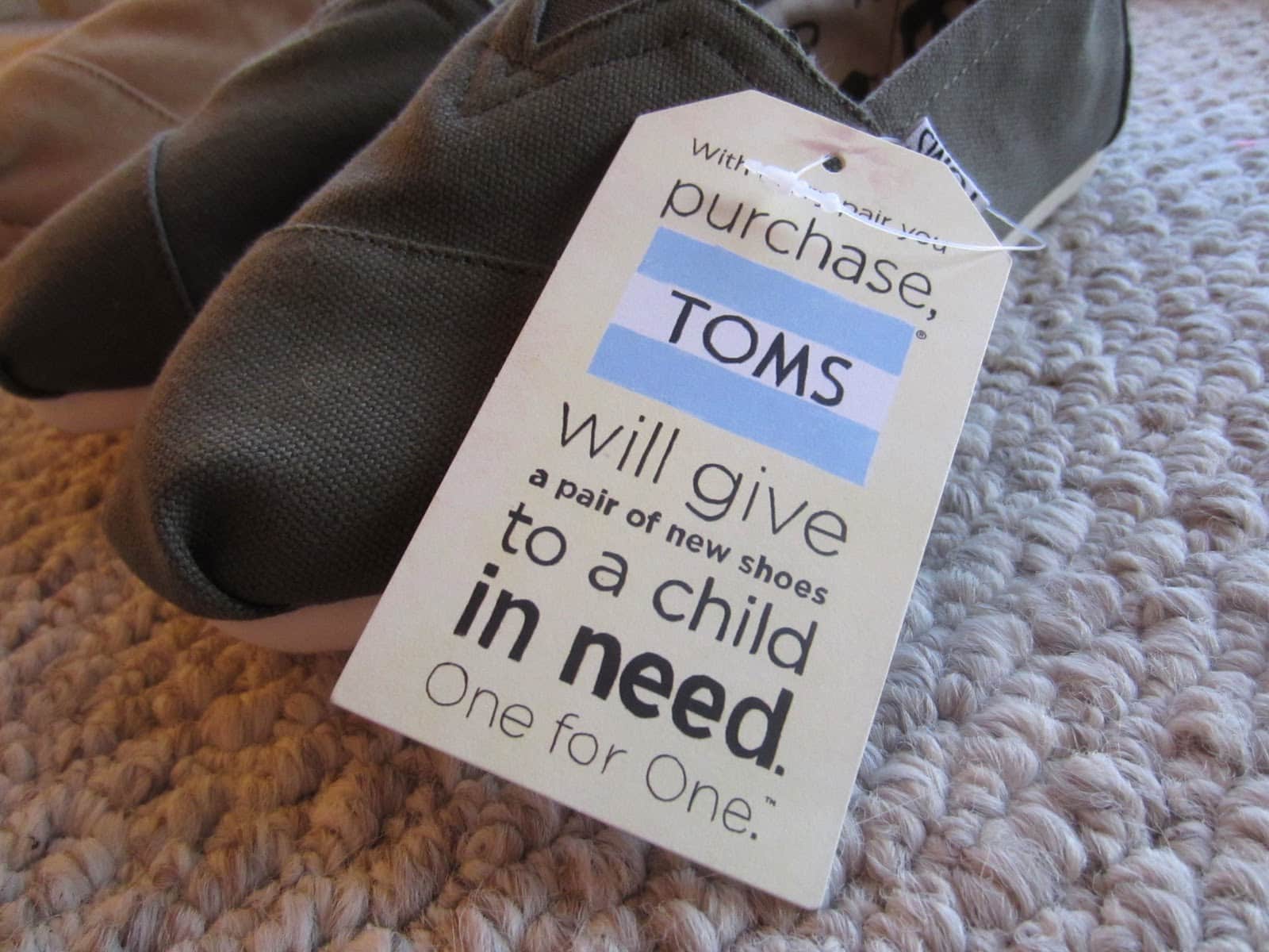 photo of Toms shoes with their impact statement