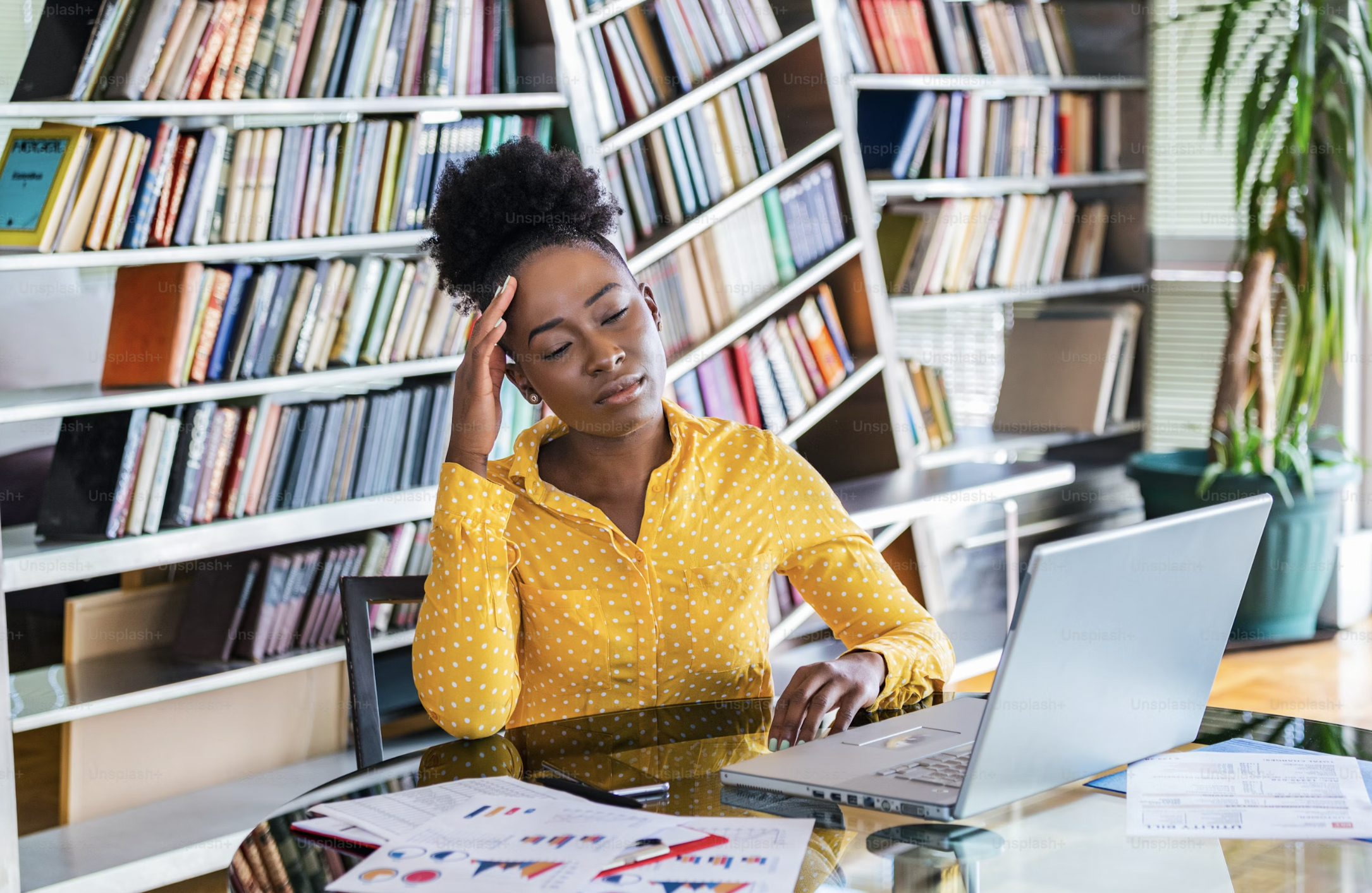 an african american woman experiencing work burnout