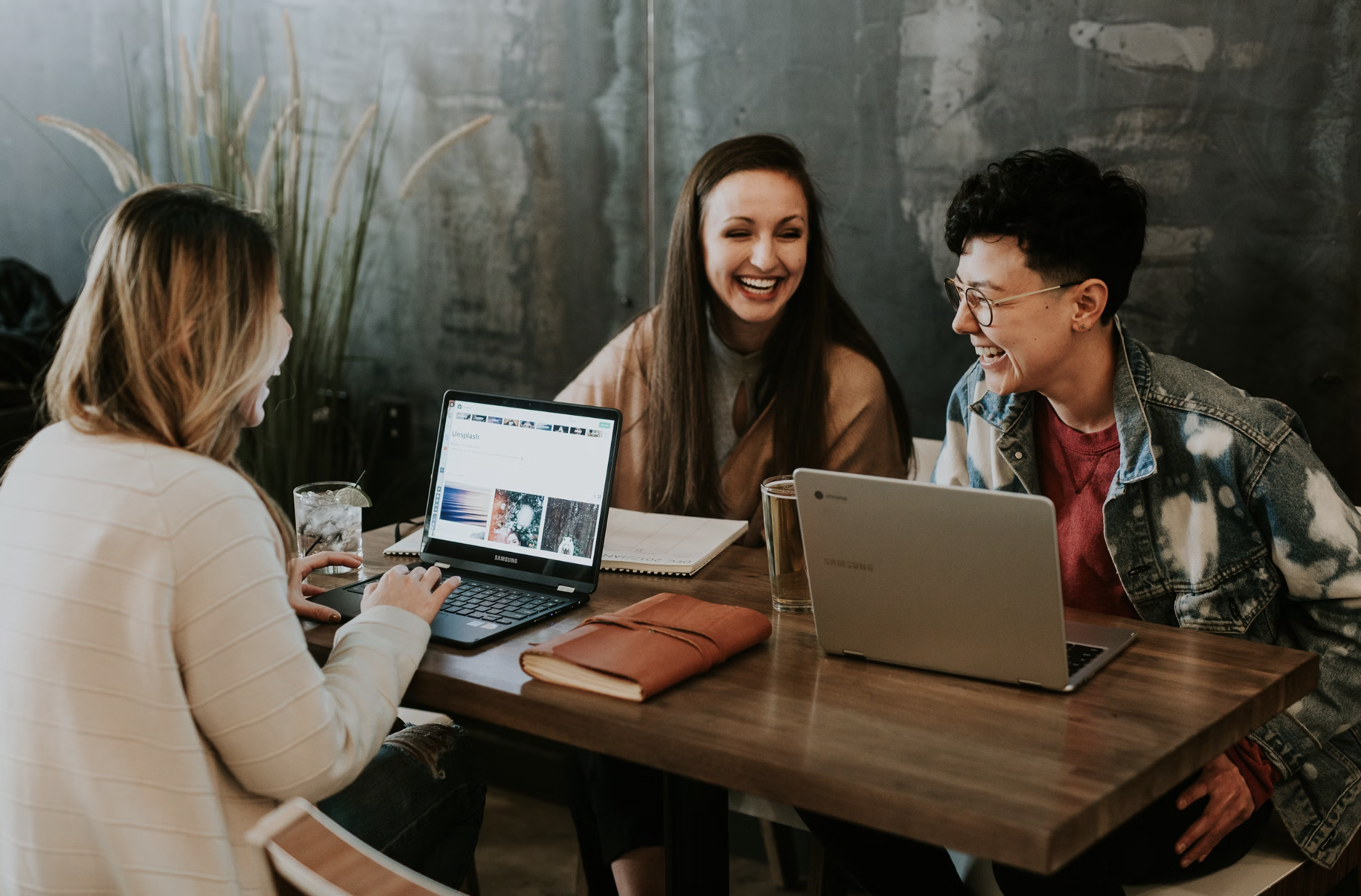 a team with inclusive members in a meeting showing how to keep a company human centric in the AI world